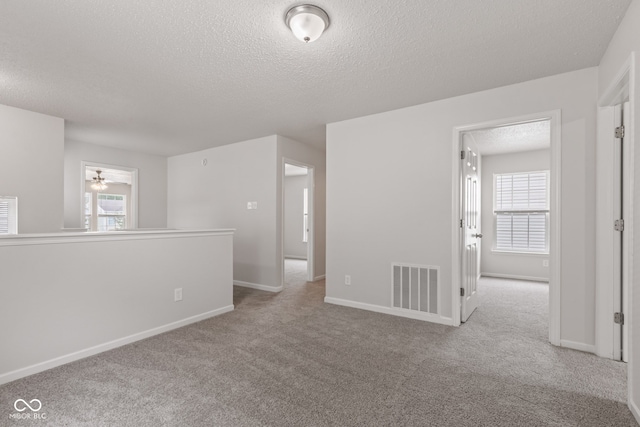 2270 Collins Way, Greenfield, IN 46140 - carpeted spare room with a textured ceiling and ceiling fan