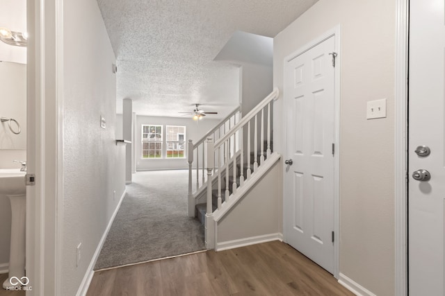 2270 Collins Way, Greenfield, IN 46140 - entryway featuring a textured ceiling, ceiling fan, stairway, and wood finished floors
