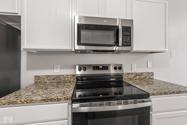 2270 Collins Way, Greenfield, IN 46140 - kitchen with stainless steel appliances, white cabinetry, and stone countertops