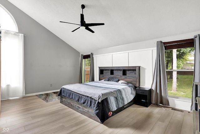 1264 Black Oak Dr, Greenwood, IN 46143 - bedroom featuring lofted ceiling, light wood-type flooring, multiple windows, and a ceiling fan