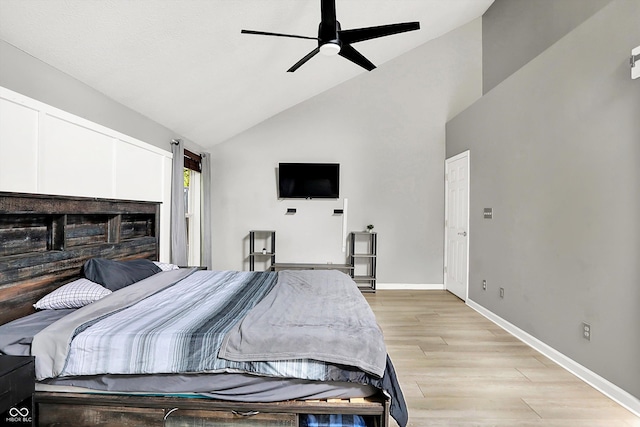 1264 Black Oak Dr, Greenwood, IN 46143 - bedroom with light wood-style flooring, baseboards, ceiling fan, and high vaulted ceiling