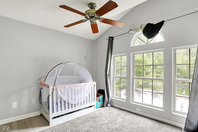 1264 Black Oak Dr, Greenwood, IN 46143 - bedroom with lofted ceiling, a crib, a ceiling fan, and baseboards