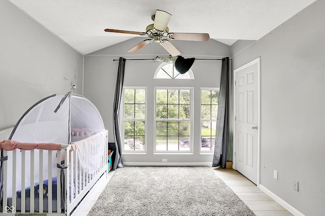 1264 Black Oak Dr, Greenwood, IN 46143 - bedroom featuring lofted ceiling, a ceiling fan, a crib, and baseboards