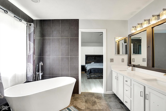 1264 Black Oak Dr, Greenwood, IN 46143 - bathroom with a freestanding tub, double vanity, ensuite bath, and tile walls