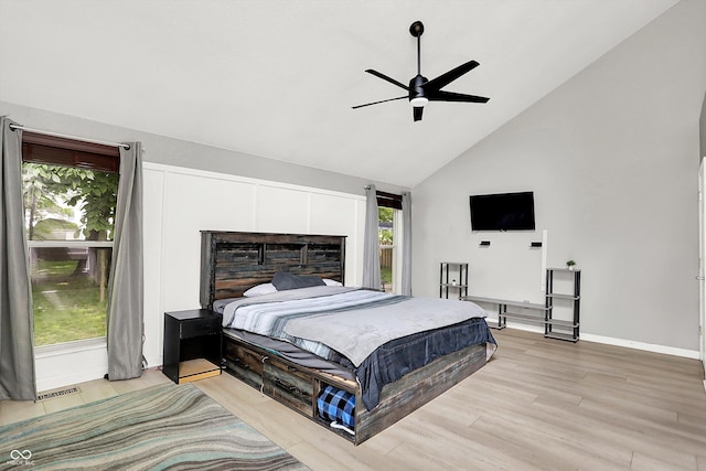 1264 Black Oak Dr, Greenwood, IN 46143 - bedroom featuring high vaulted ceiling, multiple windows, light wood-style floors, and baseboards