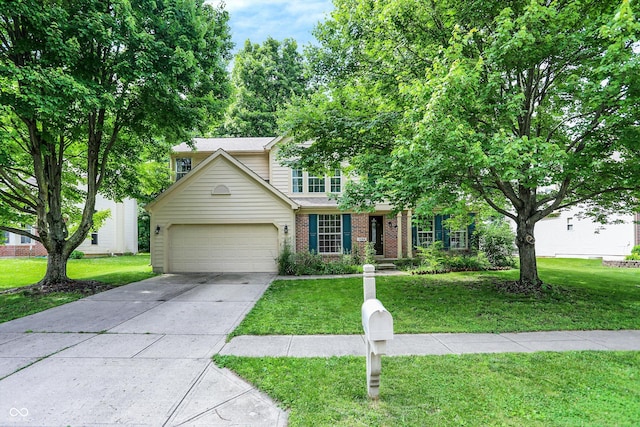 1264 Black Oak Dr, Greenwood, IN 46143 - traditional-style home featuring brick siding, a front yard, and an attached garage