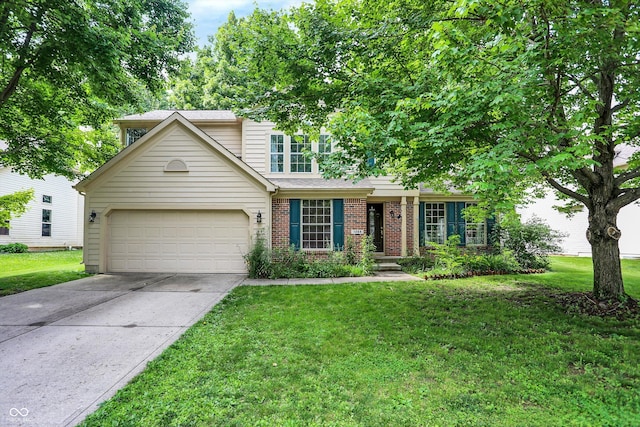 1264 Black Oak Dr, Greenwood, IN 46143 - view of front of home with concrete driveway, a front lawn, brick siding, and a garage