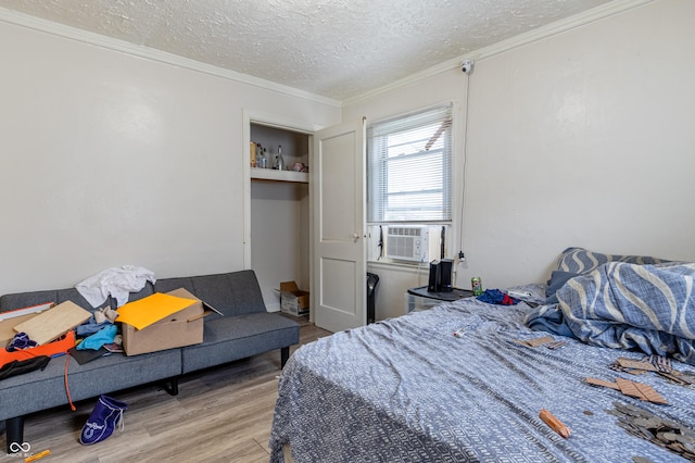 3065 N Colorado Ave, Indianapolis, IN 46218 - bedroom with wood finished floors, a textured ceiling, crown molding, and cooling unit