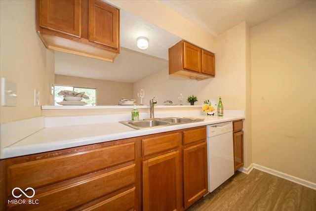 8410 Hague Rd Unit 5, Indianapolis, IN 46256 - kitchen with dishwasher, dark wood-type flooring, brown cabinets, and light countertops