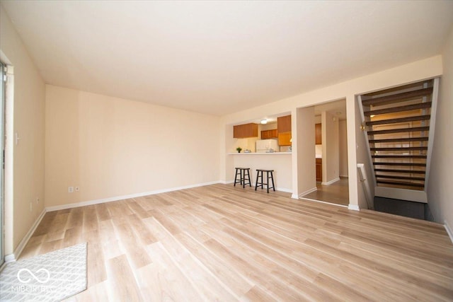 8410 Hague Rd Unit 5, Indianapolis, IN 46256 - unfurnished living room featuring light wood-style flooring and baseboards