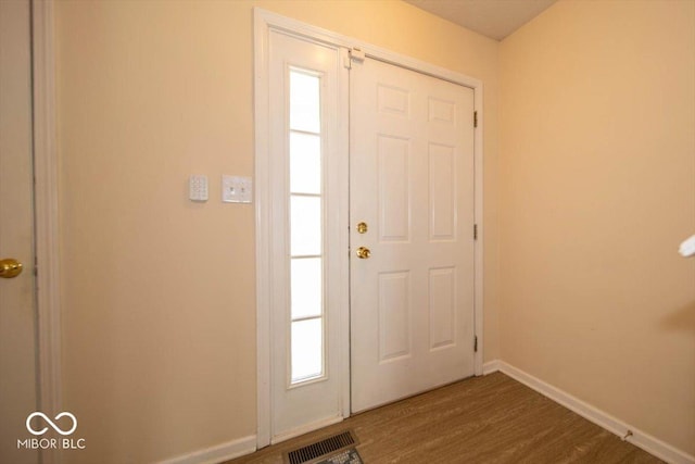 8410 Hague Rd Unit 5, Indianapolis, IN 46256 - foyer entrance featuring dark wood finished floors and plenty of natural light
