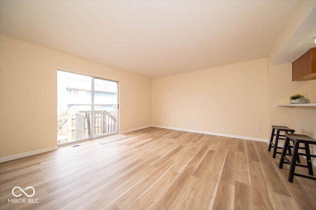 8410 Hague Rd Unit 5, Indianapolis, IN 46256 - unfurnished living room featuring light wood-style flooring and baseboards