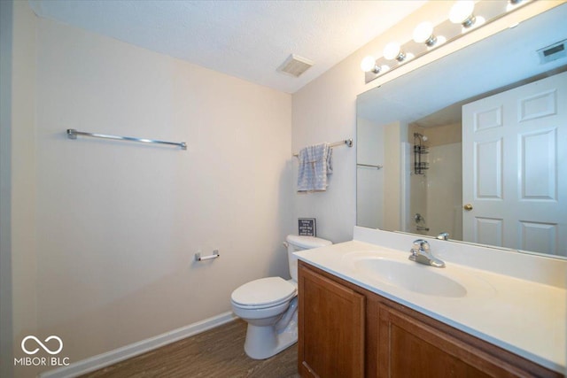 8410 Hague Rd Unit 5, Indianapolis, IN 46256 - full bathroom with vanity, wood finished floors, a shower, and a textured ceiling