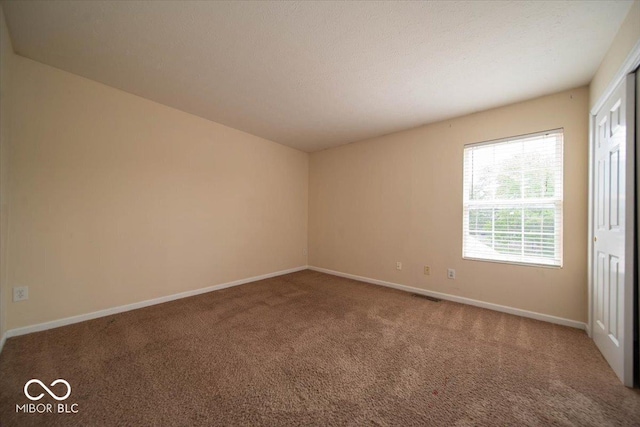 8410 Hague Rd Unit 5, Indianapolis, IN 46256 - spare room featuring carpet flooring and baseboards