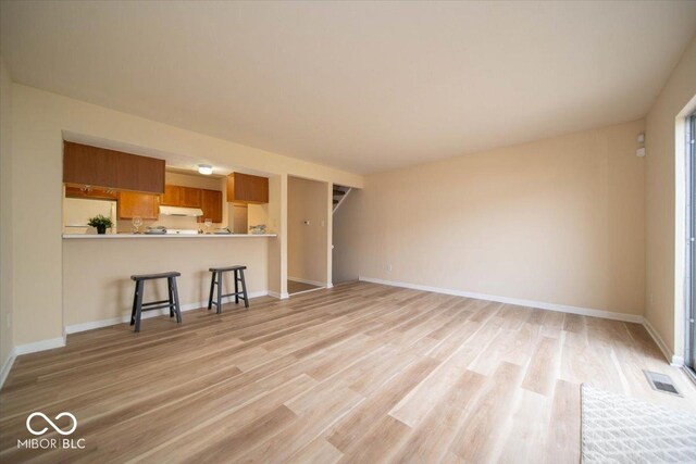 8410 Hague Rd Unit 5, Indianapolis, IN 46256 - unfurnished living room featuring light wood-style flooring