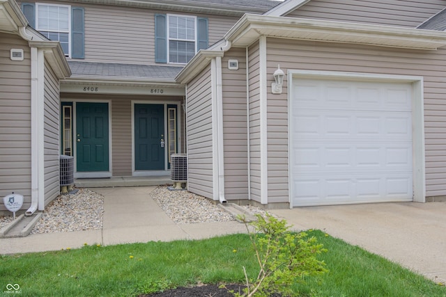 8410 Hague Rd Unit 5, Indianapolis, IN 46256 - property entrance with a garage and concrete driveway