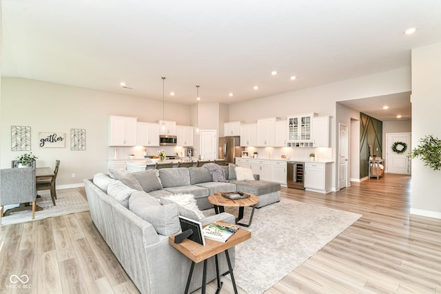 8263 Bryce Blvd, Pendleton, IN 46064 - living area featuring wine cooler, light wood finished floors, baseboards, and recessed lighting