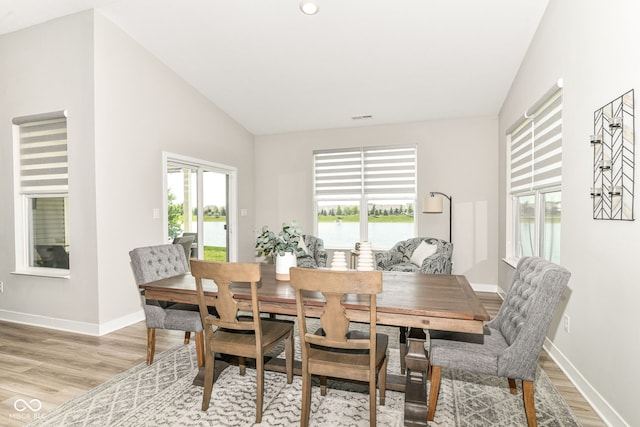 8263 Bryce Blvd, Pendleton, IN 46064 - dining room with light wood-style floors, lofted ceiling, and baseboards