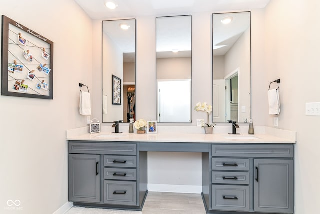 8263 Bryce Blvd, Pendleton, IN 46064 - bathroom with double vanity, baseboards, and recessed lighting