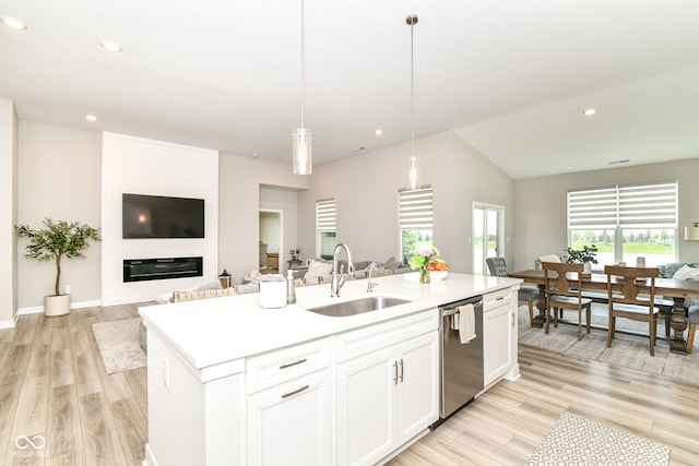 8263 Bryce Blvd, Pendleton, IN 46064 - kitchen featuring a sink, open floor plan, dishwasher, lofted ceiling, and recessed lighting