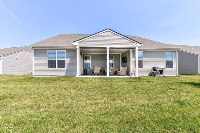 8263 Bryce Blvd, Pendleton, IN 46064 - back of house featuring an outdoor living space, a patio area, a lawn, and roof with shingles