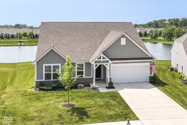 8263 Bryce Blvd, Pendleton, IN 46064 - view of front of house with a garage, a water view, driveway, a front yard, and roof with shingles