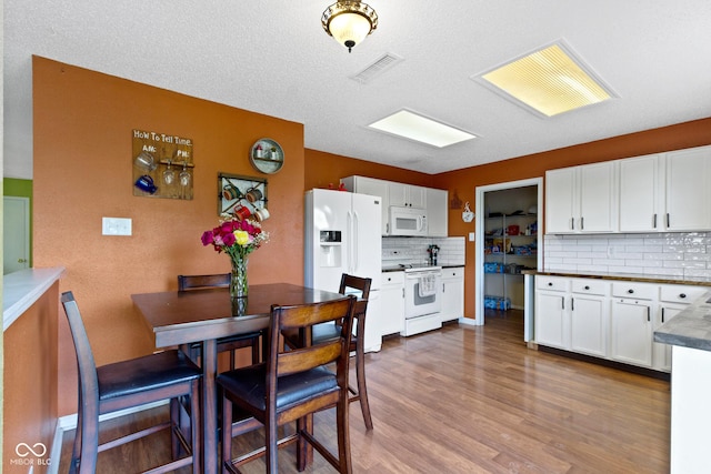 3362 Pavetto Ln, Indianapolis, IN 46203 - dining space featuring dark wood-style flooring