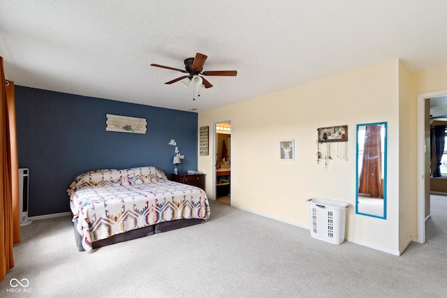 3362 Pavetto Ln, Indianapolis, IN 46203 - carpeted bedroom with ceiling fan, a textured ceiling, and connected bathroom