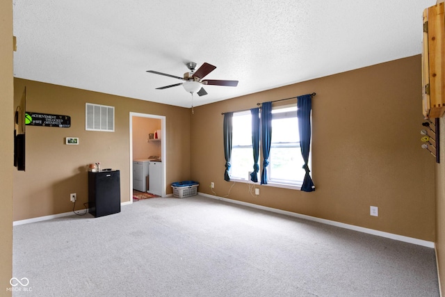 3362 Pavetto Ln, Indianapolis, IN 46203 - unfurnished bedroom with separate washer and dryer, carpet floors, a textured ceiling, and a ceiling fan