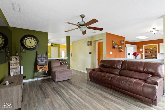 3362 Pavetto Ln, Indianapolis, IN 46203 - living area featuring wood finished floors and a ceiling fan