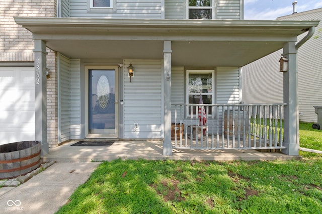 3362 Pavetto Ln, Indianapolis, IN 46203 - doorway to property featuring a porch and brick siding