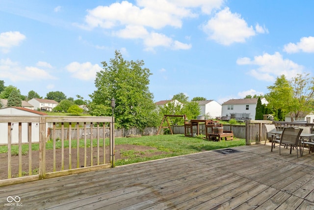 3362 Pavetto Ln, Indianapolis, IN 46203 - wooden terrace featuring a fenced backyard, a residential view, and outdoor dining area