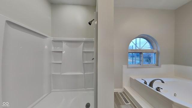5939 Brendonridge Ct S, Indianapolis, IN 46226 - full bathroom with a shower stall, a whirlpool tub, and baseboards