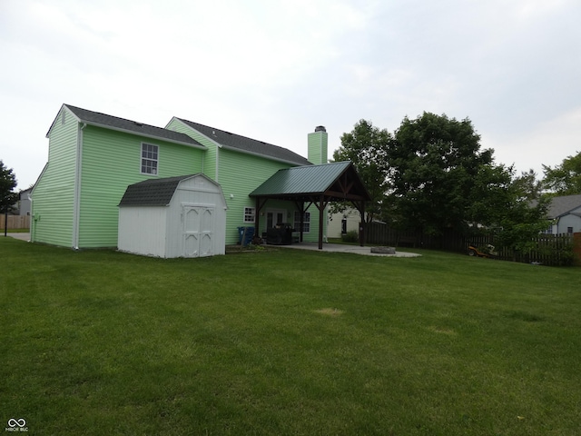6714 Colleens Way, Indianapolis, IN 46221 - back of house featuring a gazebo, a patio, and a chimney