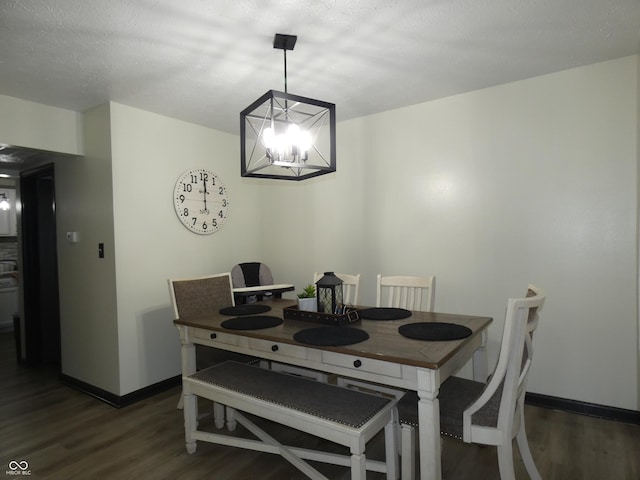 6714 Colleens Way, Indianapolis, IN 46221 - dining space with wood finished floors, a chandelier, and baseboards