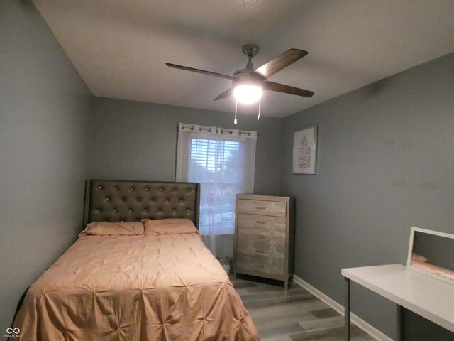 6714 Colleens Way, Indianapolis, IN 46221 - bedroom featuring light wood-type flooring, baseboards, and a ceiling fan