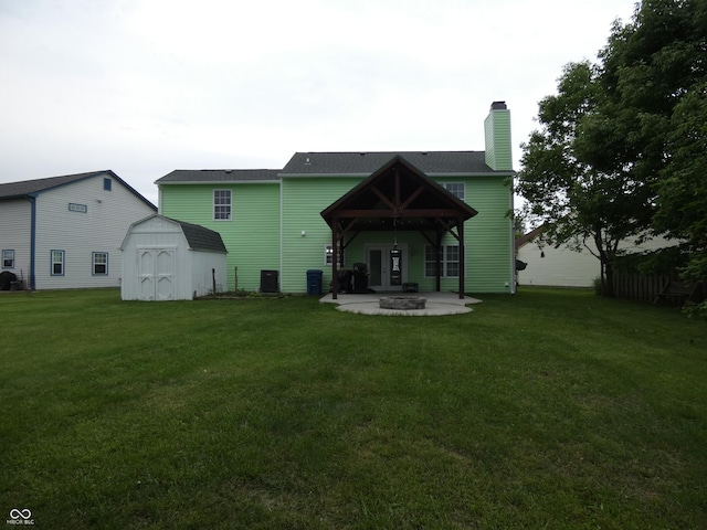 6714 Colleens Way, Indianapolis, IN 46221 - back of house with a patio, a lawn, a chimney, and french doors