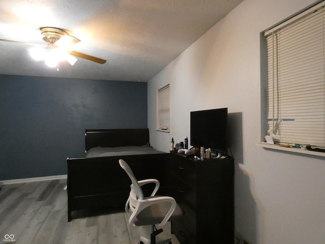6714 Colleens Way, Indianapolis, IN 46221 - home office with wood finished floors and a ceiling fan