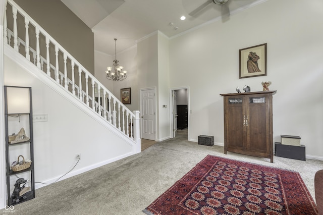2553 Forest Hills Blvd, Greenwood, IN 46143 - carpeted entryway featuring a towering ceiling, baseboards, stairway, ornamental molding, and a chandelier