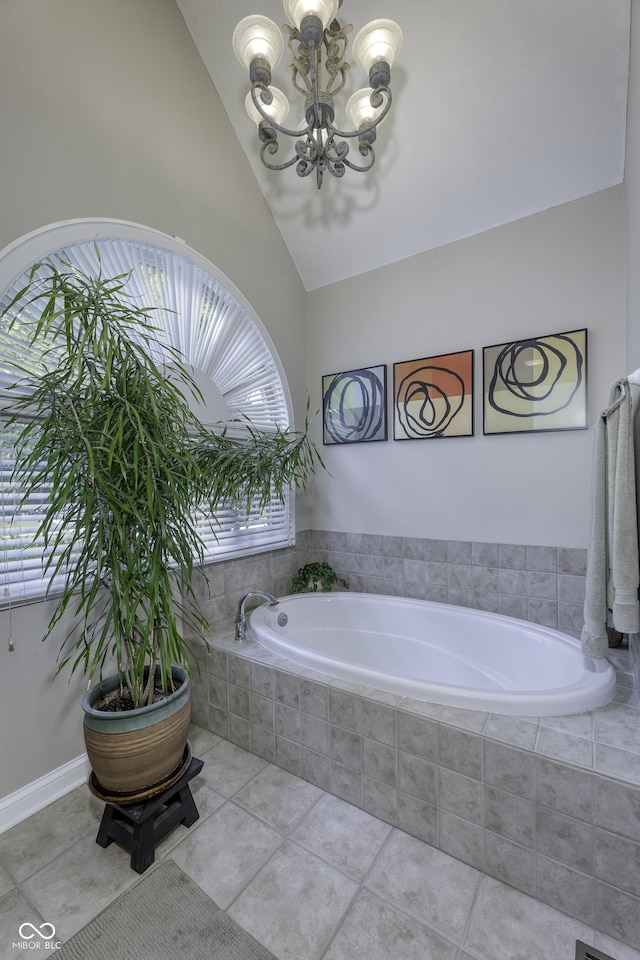 2553 Forest Hills Blvd, Greenwood, IN 46143 - full bath with a chandelier, vaulted ceiling, a bath, and tile patterned floors