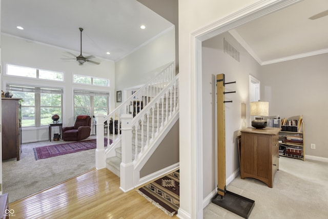 2553 Forest Hills Blvd, Greenwood, IN 46143 - stairs with a ceiling fan, crown molding, baseboards, recessed lighting, and wood finished floors