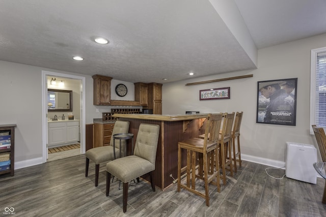 2553 Forest Hills Blvd, Greenwood, IN 46143 - indoor bar featuring baseboards, dark wood finished floors, and recessed lighting