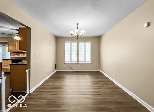7211 Topp Creek Ct, Indianapolis, IN 46214 - unfurnished dining area with a chandelier, dark wood-type flooring, and ceiling fan