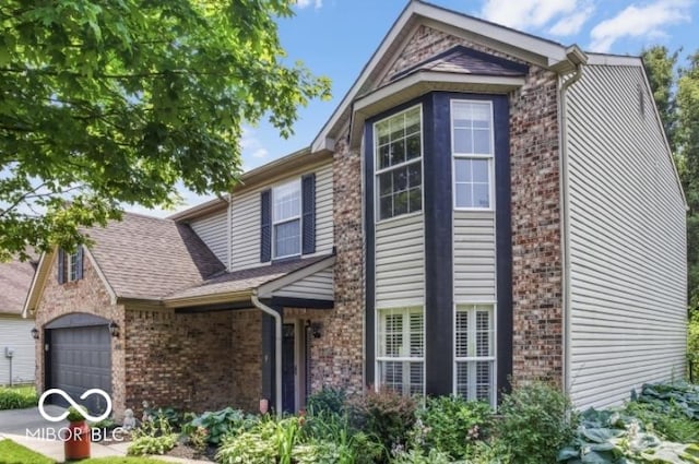 7211 Topp Creek Ct, Indianapolis, IN 46214 - view of front of property with brick siding, an attached garage, and a shingled roof