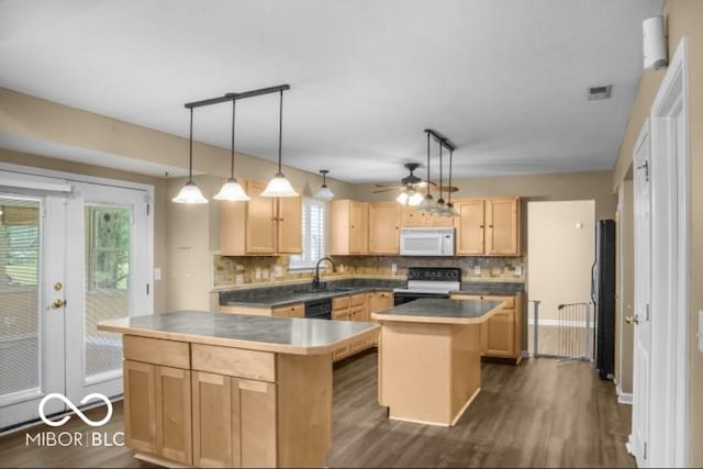 7211 Topp Creek Ct, Indianapolis, IN 46214 - kitchen with white microwave, black / electric stove, a center island, light brown cabinets, and decorative backsplash