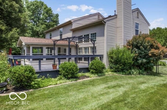 7211 Topp Creek Ct, Indianapolis, IN 46214 - back of property featuring a lawn, a wooden deck, and a chimney