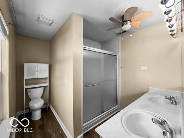7211 Topp Creek Ct, Indianapolis, IN 46214 - full bath featuring a shower stall, wood finished floors, double vanity, and a ceiling fan