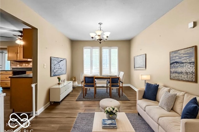 7211 Topp Creek Ct, Indianapolis, IN 46214 - living area featuring a chandelier, dark wood finished floors, and a ceiling fan