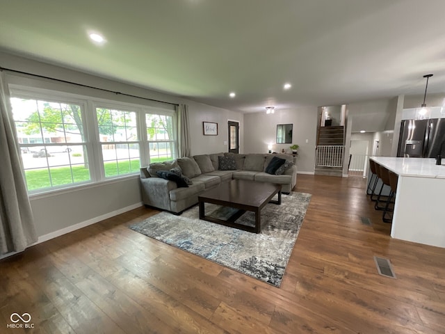 3520 Lantern Ln, Columbus, IN 47203 - living room with baseboards, dark wood-type flooring, recessed lighting, and stairs
