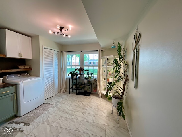 3520 Lantern Ln, Columbus, IN 47203 - washroom featuring cabinet space, light marble finish flooring, and baseboards